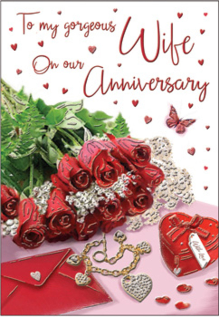 This anniversary card presents a richly detailed still life that could easily belong on a polished table in a Seven Sisters flat, just after a special delivery has arrived. Dominating the scene is a compact bouquet of classic red roses, each bloom full and rounded, with petals that twist and curl in layered spirals, creating a sense of volume and indulgent softness. The deep red hues are intensified by the soft ambient light, which glides gently over the petals and makes them appear almost velvety to the touch. Nestled among the roses, sprays of fresh greenery introduce lifts of rich green, giving the arrangement airy dimension and evoking the scent and vitality of a newly cut bouquet. Just beside this floral cluster rests a crisp, pale envelope, its neat edges and subtle texture suggesting quality stationery chosen for an important message. In front of it, an elegant piece of jewellery lies thoughtfully placed, catching the light in small flashes, while a heart-shaped keepsake box sits nearby, its smooth exterior in deep red or blush tones echoing the roses' romantic palette. Scattered hearts are sprinkled across the composition like tiny confetti, recalling the joyful spirit of past anniversaries celebrated along West Green Road or in nearby parks. A delicate butterfly motif, poised near the flowers, adds a sense of gentle movement and hopefulness, as if representing the ongoing journey of a couple's love story. The overall lighting is soft yet clear, revealing every curve of the petals, every glint of metal, and every curve of the heart box without overwhelming the eye. The result is a carefully curated, intimate scene that pairs floral artistry with personal mementos, perfectly suited to marking a meaningful milestone.